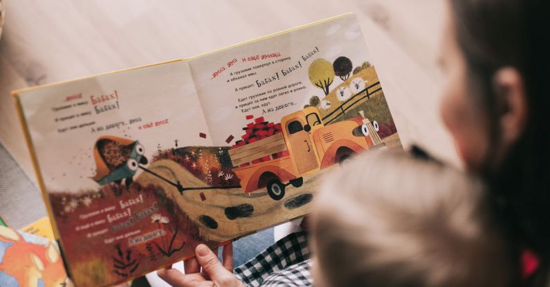 Storytelling - Woman Reading Book to Toddler