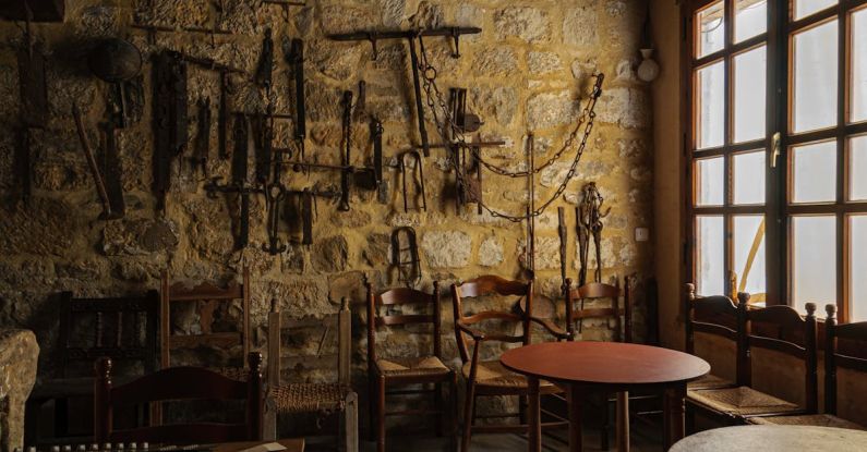 Management Tools - Table and Tools on Stone Wall in Room