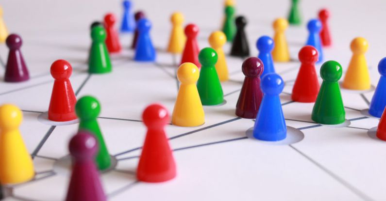 Tactics - Close Up Photography of Yellow Green Red and Brown Plastic Cones on White Lined Surface