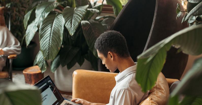 Hashtag Analytics - Man in White Dress Shirt Sitting on Brown Chair