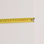 Length - Measuring tape on empty white background