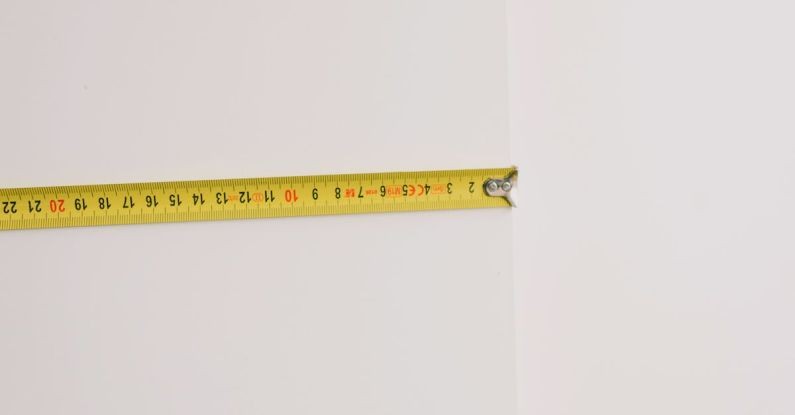 Length - Measuring tape on empty white background