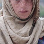 Authenticity - Portrait of a Boy with Freckles, Wearing a Headscarf