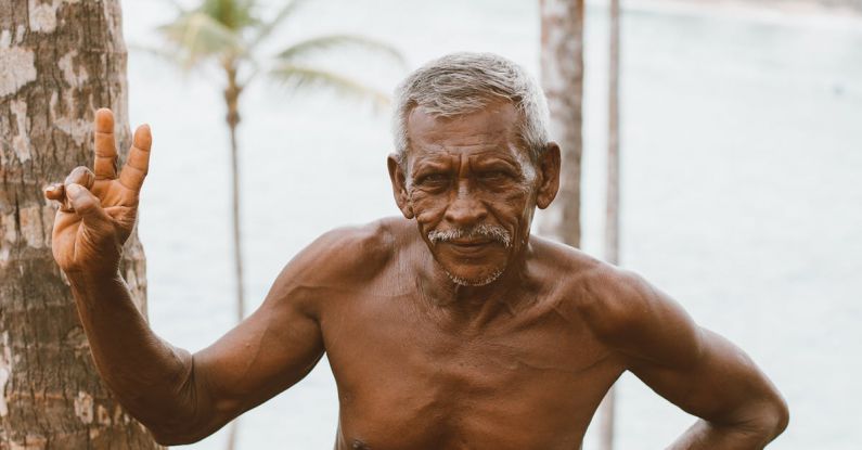 Two-Factor Authentication - Ethnic old man standing on coast of river