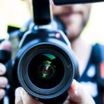 Viral Videos - Person Holding Canon Dslr Camera Close-up Photo