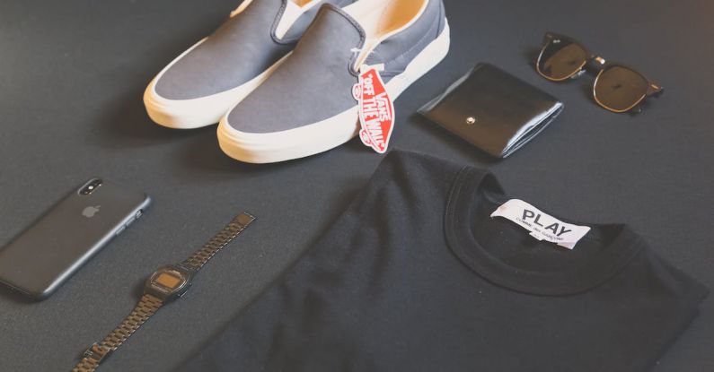 Brands - Pair of Gray Vans Low-top Sneakers Beside Black Shirt, Sunglasses, and Watch