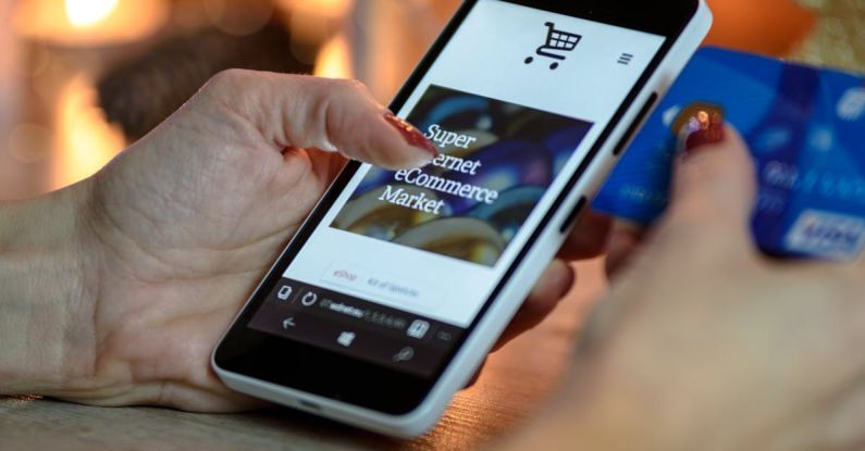 Mobile Shopping - Person Using Black And White Smartphone and Holding Blue Card