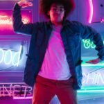 Memes - Man Dancing with Neon Lights and Signs on Background