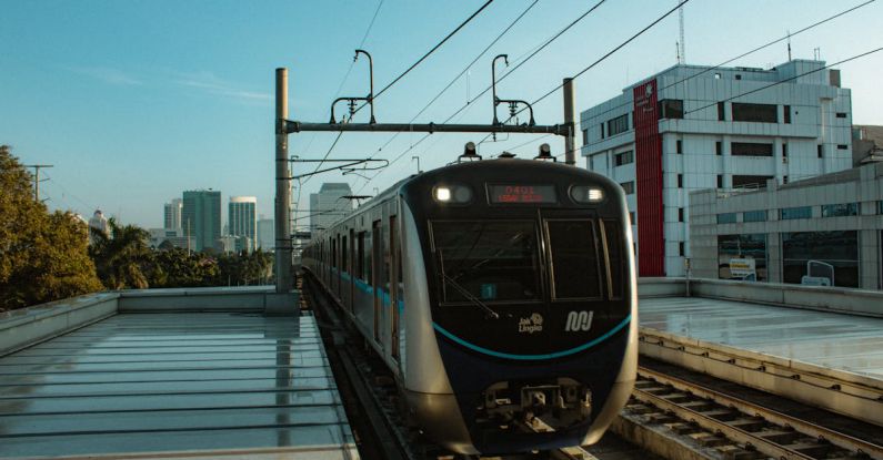 Streaming Platforms - A train is traveling down a track in a city