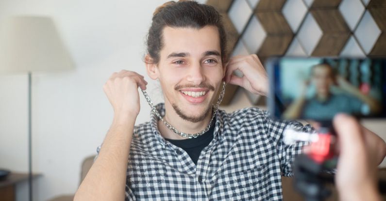 Live Streaming Rules - A Man in Checkered Long Sleeves Wearing Silver necklace